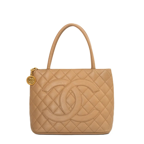 sac de seconde main medaillon chanel  en cuir beige face