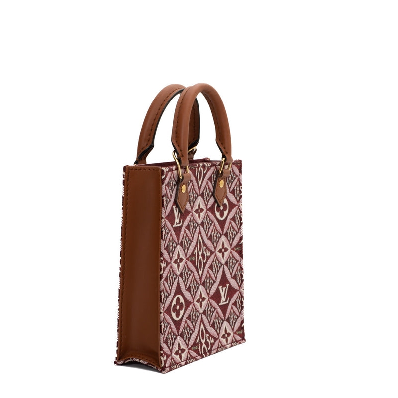 sac de seconde main plat louis vuitton  en tissu bordeaux côté