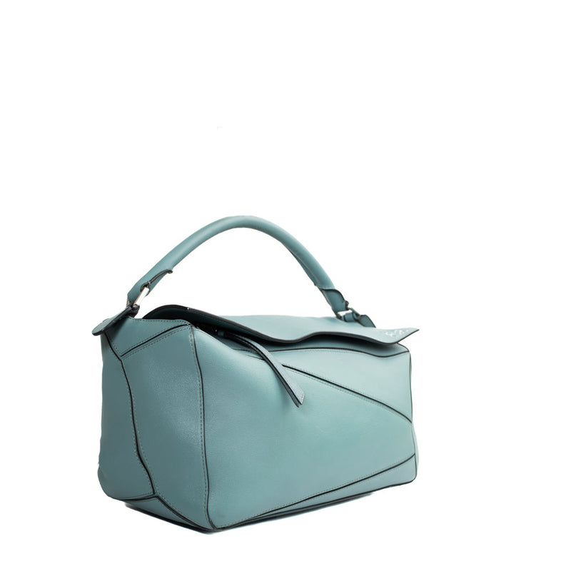 sac de seconde main puzzle  loewe en cuir bleu côté