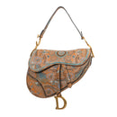 sac de seconde main saddle dior en toile beige face