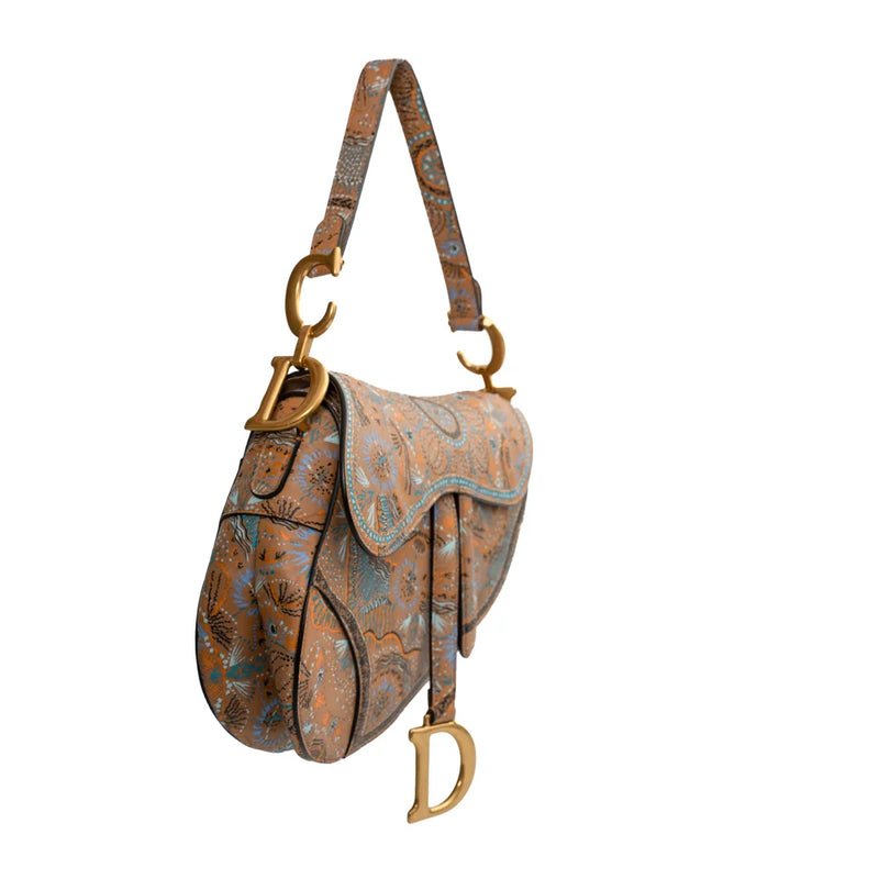 sac de seconde main saddle dior en toile beige côté