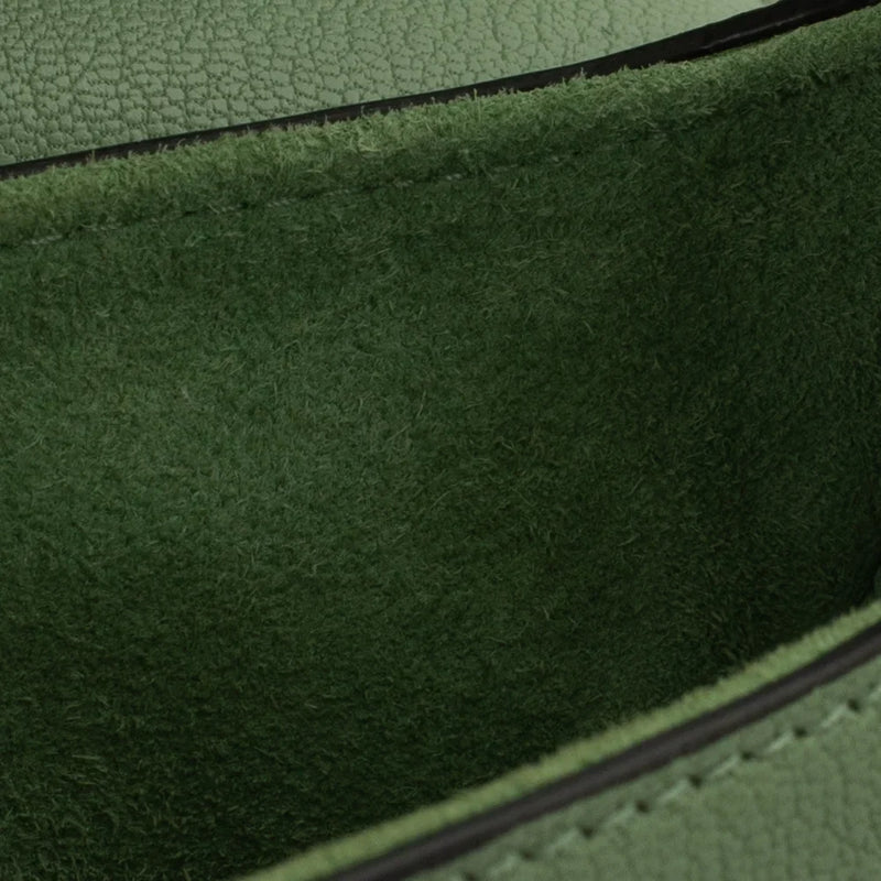 sac de seconde main saddle  dior  en cuir vert défaut 3