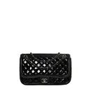 sac de seconde main timeless chanel en cuir verni noir face